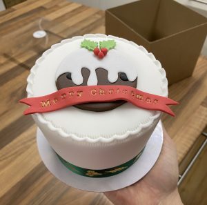 Christmas fruitcake with fondant pudding design